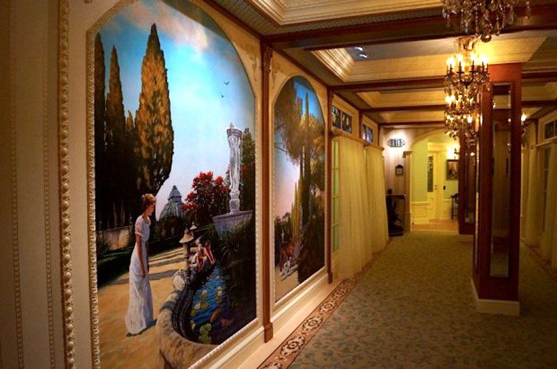 The walls of Club 33 are lined with paintings — Doyle said they made the theme "The Princess and the Frog."