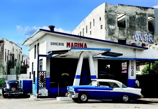 Havana, Cuba. A classic art deco gas station and matching 1950's Chevy. © 2010