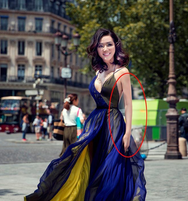 Hoa hậu Giáng My khoe sắc trên đường phố Paris. Tuy nhiên, cánh tay của cô lại trở nên nhỏ hơn bình thường rất nhiều.