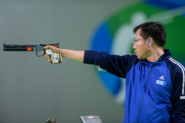 RIO DE JANEIRO - AUGUST 6: Gold medalist HOANG Xuan Vinh of Vietnam competes in the 10m Air Pistol Men Finals at the Olympic Shooting Center during Day 1 of the XXXI Olympic Games on August 6, 2016 in Rio de Janeiro, Brazil. (Photo by Nicolo Zangirolami)