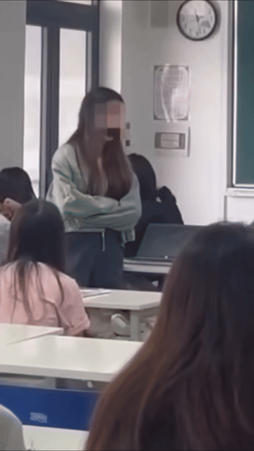 Nữ sinh viên có thái độ không đúng đắn với giảng viên khi bị nhắc nhở ăn mì trong lớp học. Ảnh cắt từ clip