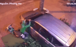Nam thanh niên mặc đồng phục Grab dùng vai bẻ kính chiếu hậu ô tô khiến nhiều người ngao ngán