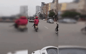 Clip: Người phụ nữ đi xe máy ngang nhiên 'làm xiếc' giữa đường phố nhiều xe cộ lưu thông