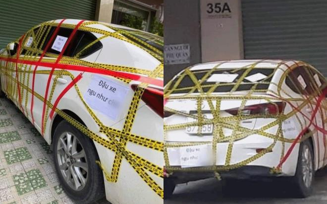 Đậu xe chắn cửa nhà dân, ô tô bị chủ nhà dán chằng chịt băng dính kèm thêm tờ giấy 'dằn mặt' Ảnh 2