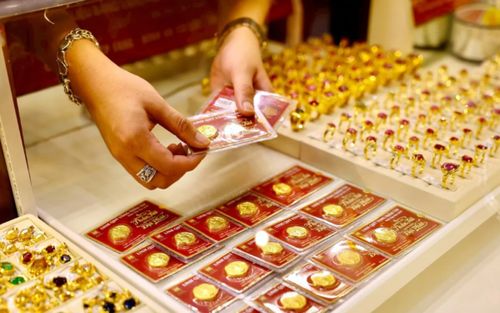 Tin tài chính hôm nay 5/12: Giá vàng giảm mạnh, USD hạ nhiệt