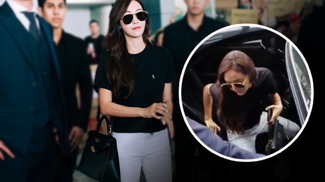 Jessica được hộ tống nghiêm ngặt khi di chuyển vào khách sạn