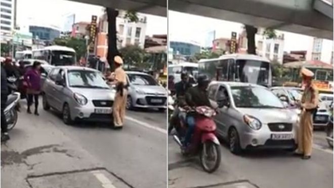 Nữ tài xế quyết 'cố thủ' trên xe, đẩy CSGT đi xa 100m đã mang giấy tờ đến trình diện công an