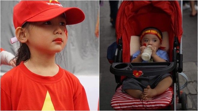 Cổ động viên nhí dễ thương theo chân cha mẹ đi khắp nơi, từ chỗ mưa to đến nơi bão tuyết cổ vũ U23 Việt Nam