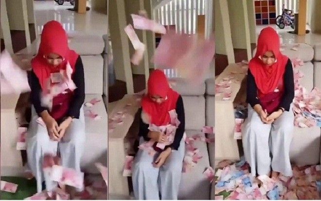 Giật chồng của bạn, cô gái trẻ bị trừng phạt bằng cách 'tắm' trong… đống tiền