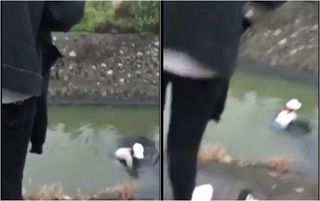 Giận người yêu, cô gái thẳng tay ném phăng điện thoại xuống mương rồi lại hối hận nhảy xuống mò tìm nhưng không thấy