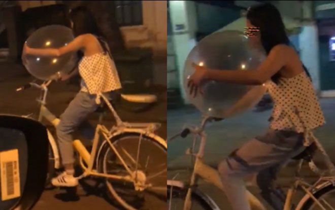 Xôn xao clip cô gái vừa đi xe đạp vừa thản nhiên hít bóng cười trên đường phố