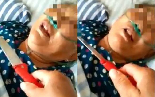 Con gái kề dao vào cổ mẹ già đang nằm viện gây phẫn nộ