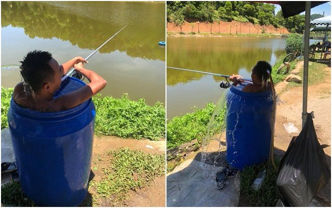 Nhiệt độ thực tế ngoài trời lên đến 50 độ C, người đàn ông vừa ngâm mình trong thùng phuy đầy nước vừa câu cá tận hưởng cuộc sống