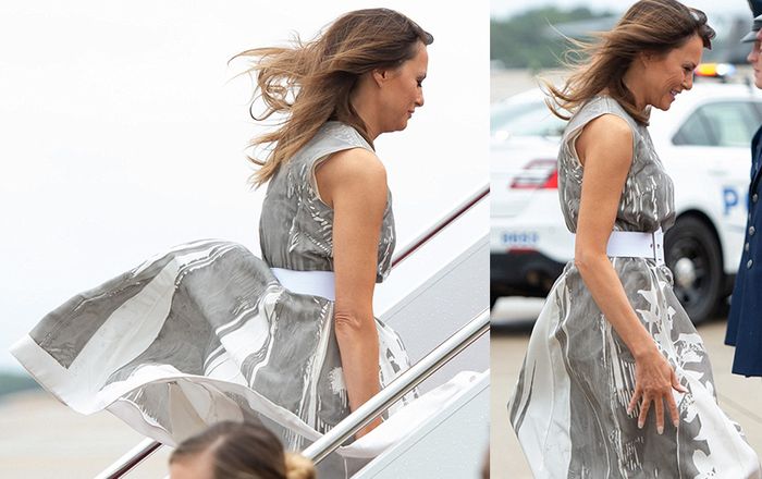 Đệ nhất phu nhân Mỹ Melania Trump ngại ngùng vì bị gió thổi tốc váy khi lên máy bay