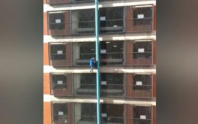 Tay không leo lên đỉnh bãi đỗ xe 8 tầng, cô gái khiến ai nấy kinh ngạc