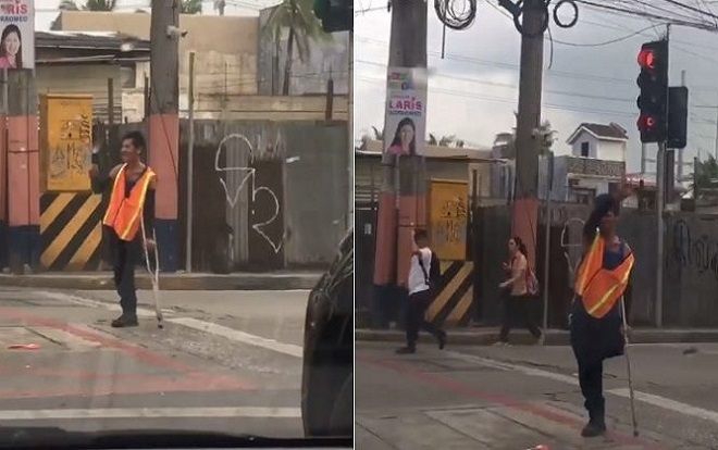 Người đàn ông tàn tật điều khiển giao thông truyền cảm hứng cho mọi người