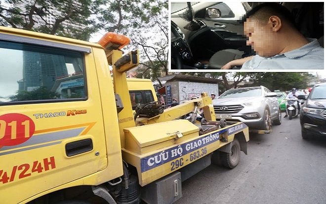 Ngủ quên trong khi dừng đèn đỏ, tài xế gây ùn tắc đường khiến CSGT phải cẩu cả xe lẫn người
