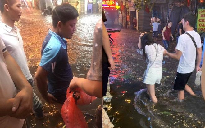 'Cơn mưa ngang qua' gây ngập úng nặng lúc nửa đêm, dân Hà Nội phải bì bõm… lội đi chơi lễ
