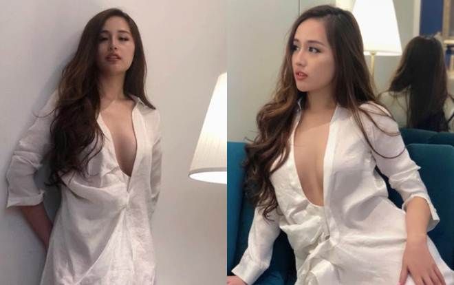 Vòng 1 tuyệt đẹp nên Mai Phương Thúy có sở thích buông lơi cúc áo hờ hững