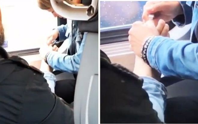 Thản nhiên cắt móng chân cho nhau trên tàu lửa, cặp đôi khiến người khác lắc đầu ngao ngán