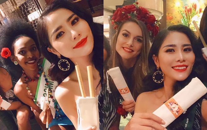 Thí sinh Miss Earth 2019 nâng niu món quà của Hoàng Hạnh trao tặng
