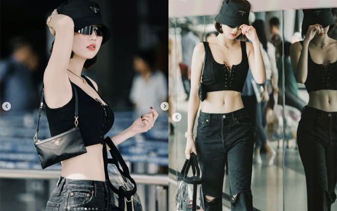 Ngọc Trinh khoe cơ bụng số 11 với set đồ Prada, chất chơi với mốt mũ cái xô kén mặt