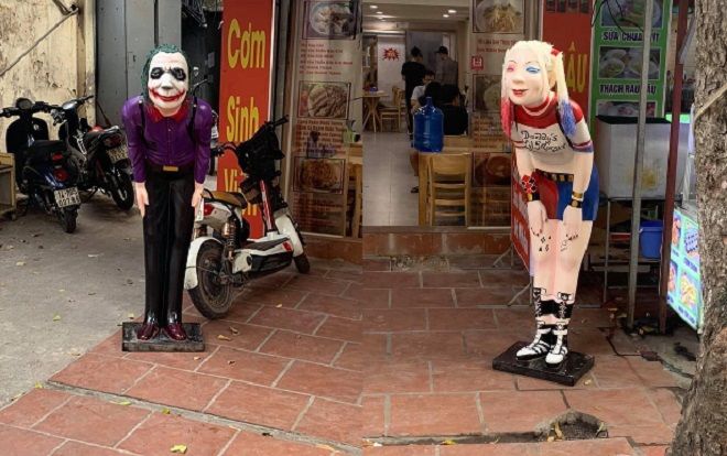 Chủ quán cơm sinh viên đặt 2 bức tượng Joker và Harley Quinn tươi cười đón khách khiến bất kỳ ai ngang qua cũng phải ngước nhìn