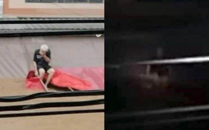 Người đàn ông mắc kẹt trên mái nhà vì lũ lụt, bất lực cầu cứu trong vô vọng