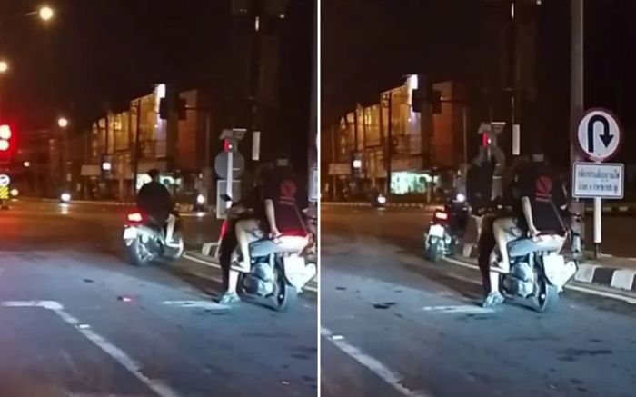 Người đàn ông đi xe máy tự điều chỉnh đèn giao thông tại ngã tư