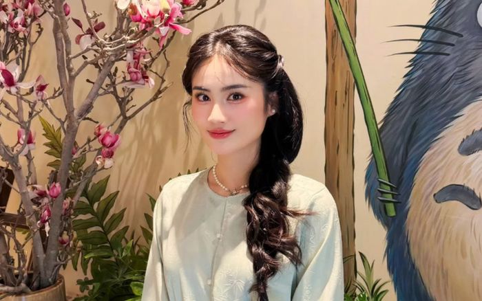 Hoa hậu Ý Nhi khoe nhan sắc dịu dàng khi về Việt Nam đón Tết