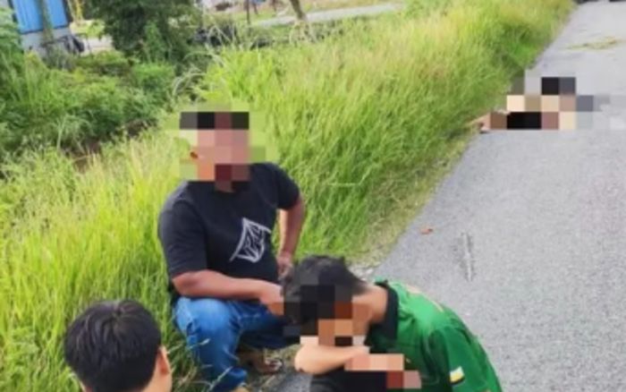 Người đàn ông chở lưỡi liềm bằng xe máy, gây ra sự việc thương tâm