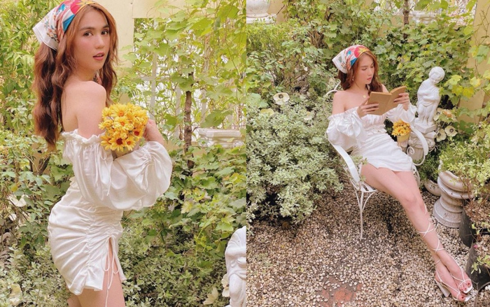 Ngọc Trinh tựa thiên thần quyến rũ trong vườn hoa lá với set đồ trắng gợi cảm