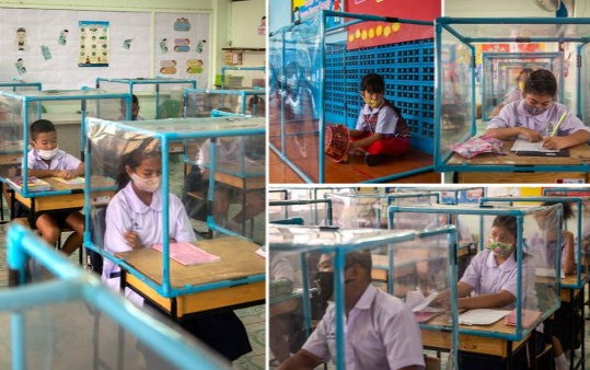 Đi học giữa mùa dịch, học sinh ngồi trong hộp nhựa để tránh COVID-19