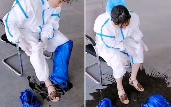 Clip nhân viên y tế Trung Quốc 'đổ cả xô mồ hôi' vì trời nóng gây xúc động