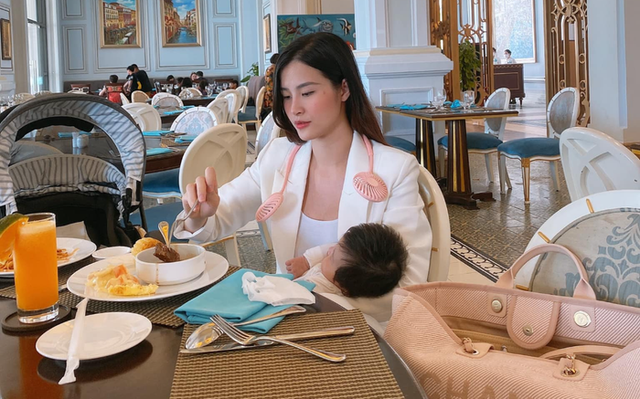 Đông Nhi vừa đi tiệc, vừa bế Winnie: 'Đằng sau những bức hình lồng lộn và một bà mẹ bỉm sữa đang vật lộn'