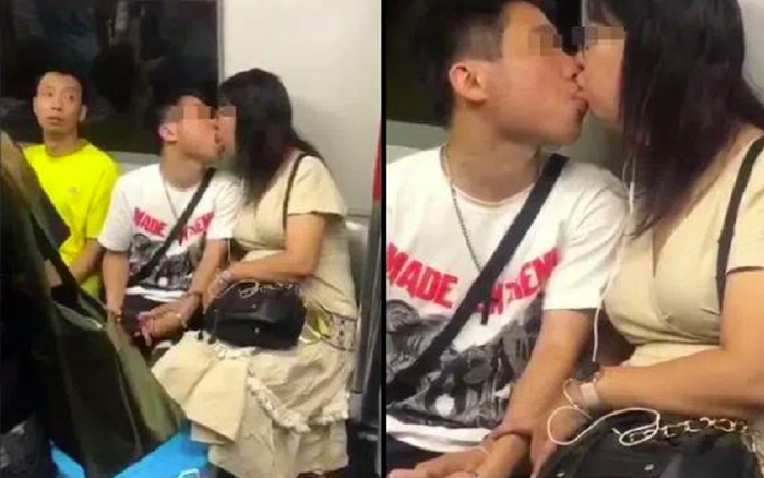 Cặp đôi ôm hôn cuồng nhiệt trên tàu điện ngầm, thái độ của người đàn ông bên cạnh gây chú ý
