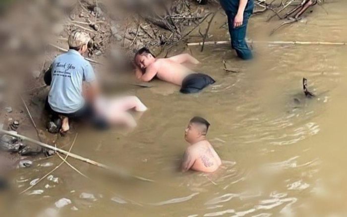 Người đàn ông kiệt sức sau khi liều mình nhảy xuống sông cứu người phụ nữ đuối nước