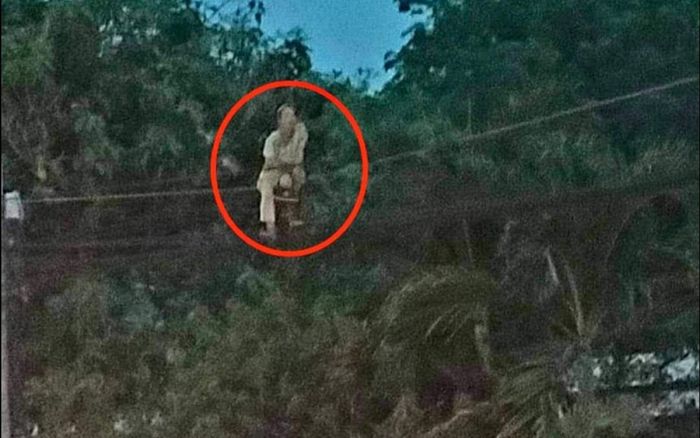 Danh tính bất ngờ người phụ nữ trèo lên dây điện ngồi vắt vẻo gây xôn xao