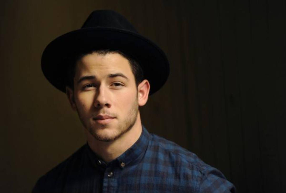 In this Oct. 29, 2014 photo, recording artist and actor Nick Jonas poses for a portrait in Los Angeles to promote his self-titled album, out Nov. 11. (Photo by Chris Pizzello/Invision/AP)