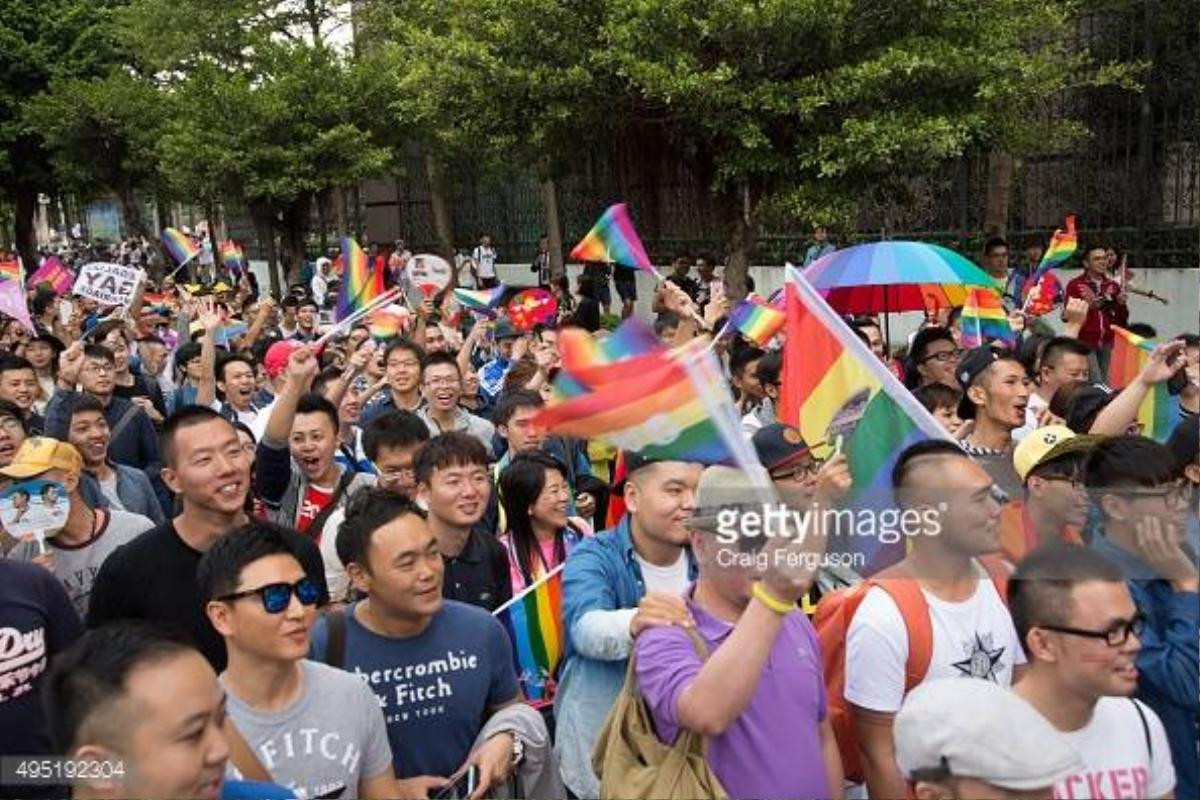 TAIPEI, TAIWAN - 2015/10/31: Large crowds carrying signs and waving rainbow flags came out to show their support for gay rights at the LGBT Pride celebration. Upwards of 60 000 people took to the streets of Taipei for the annual Pride march, the largest such event in Asia. Taiwan is often said to be the likliest Asian nation to legalize gay marriage. (Photo by Craig Ferguson/LightRocket via Getty Images)