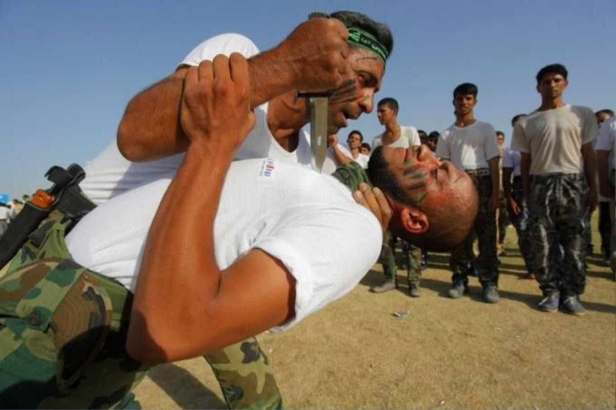 like-the-ypg-iraqs-shia-militias-are-one-of-the-major-ground-forces-fighting-isis-here-members-of-a-militia-demonstrate-close-quarter-combat-skills-at-a-graduation-ceremony