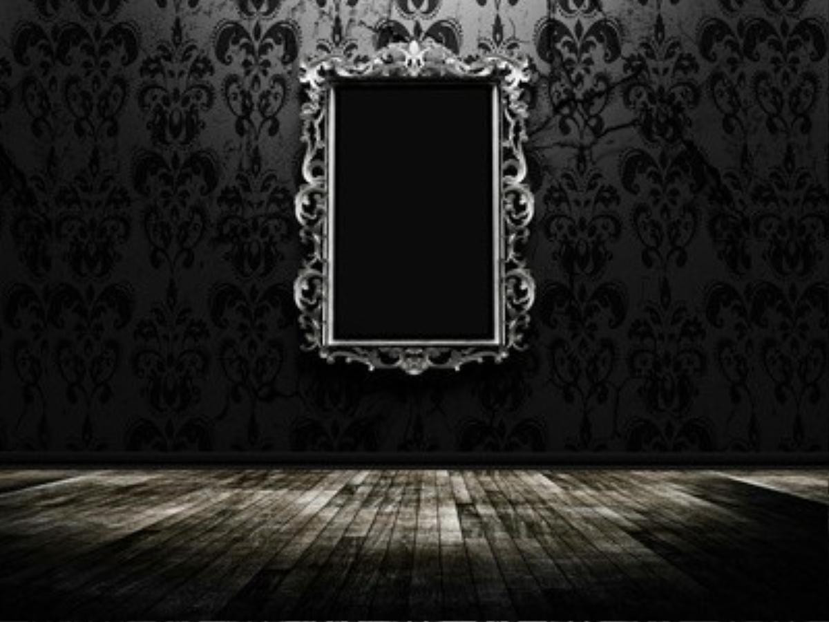 a beautiful vintage mirror in a dark room