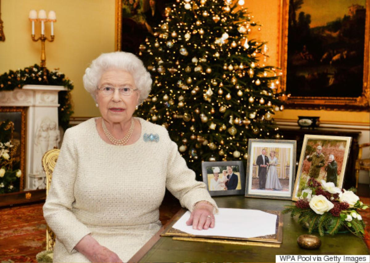 LONDON, ENGLAND - DECEMBER 25: Queen Elizabeth II sits at a desk in the 18th Century Room at Buckingham Palace, after recording her Christmas Day broadcast to the Commonwealth on December 25, 2015 in London, England. (Photo by John Stillwell-WPA Pool/Getty Images)