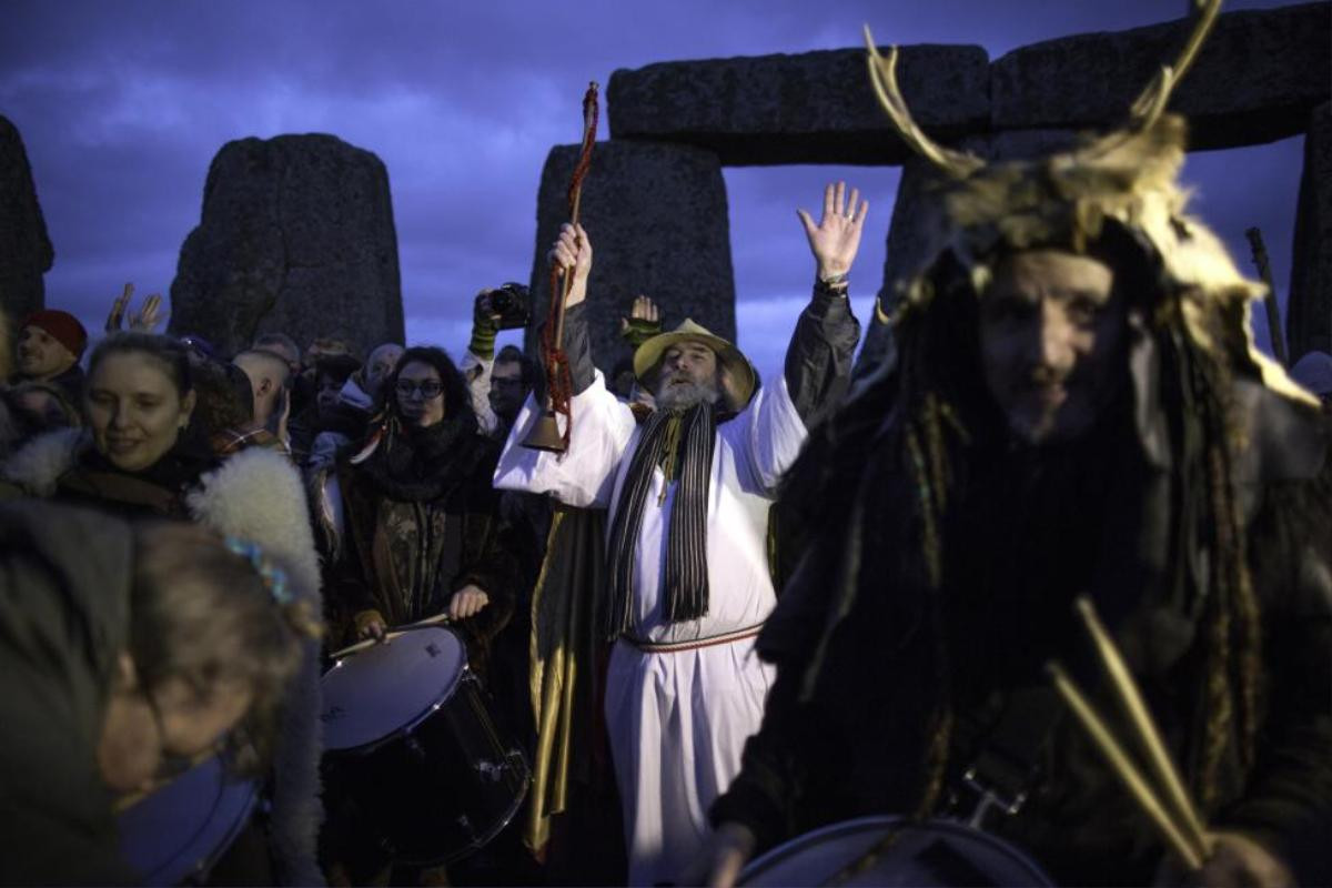 Revelers celebrate the winter solstice at Stonehenge on Salisbury Plain in southern England December 22, 2015. REUTERS/Kieran Doherty