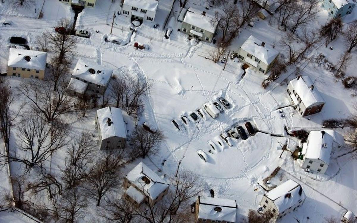 16 Cars and houses in a southwest Connecticut neighbourhood are covered in snow