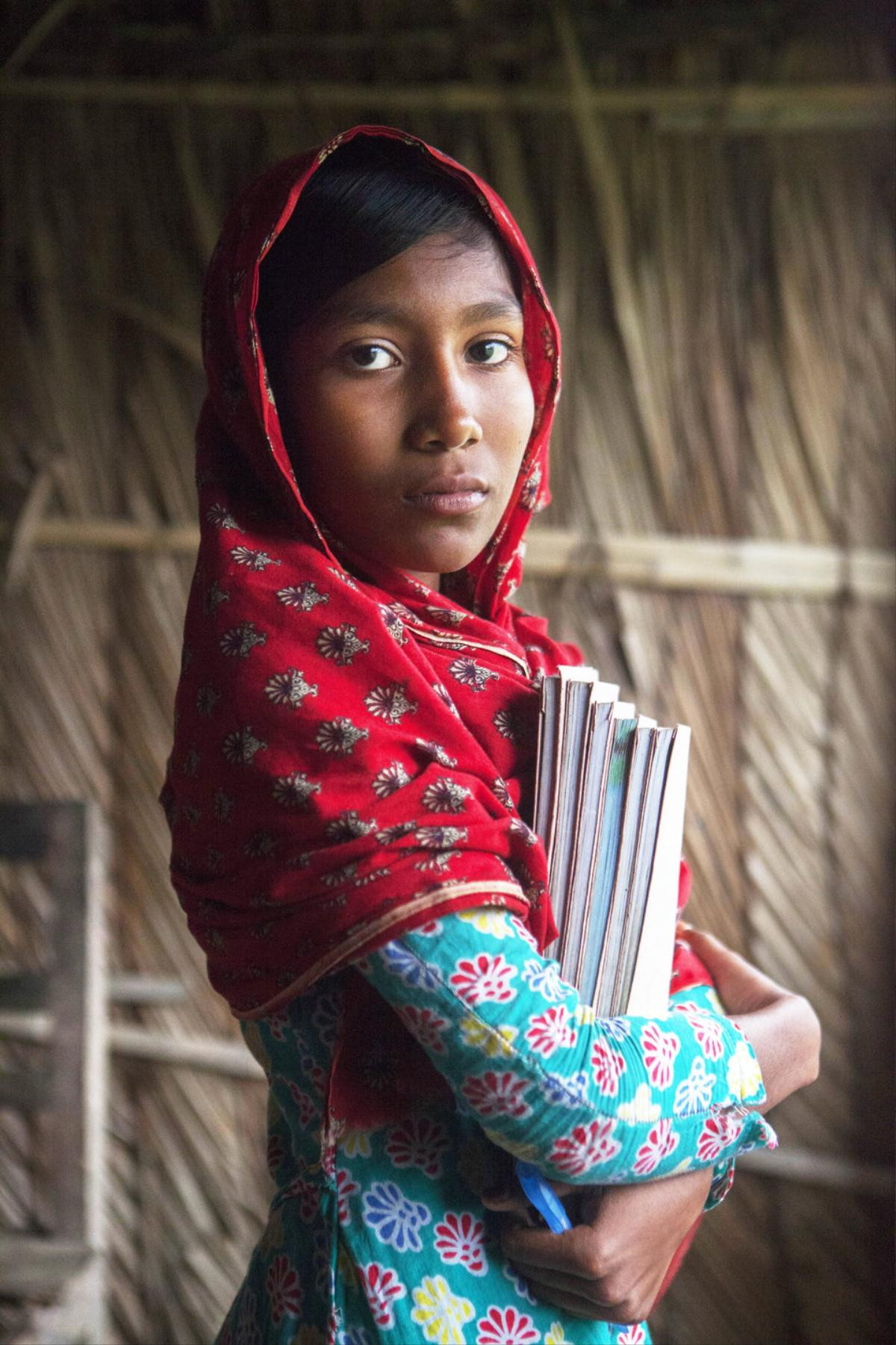 SATKHIRA, BANGLADESH - JANUARY 21: School girl looks on after the rise of sea-level as Department of Environment's study, conducted between April 2013 and Oct 2015, which analyzed tidal water data of the last 30 years in the entire coastal zones of the country, shows that annual rise of sea level in Bangladesh, ranges between 6mm and 20mm, poses threats to the country's agriculture, land and population, in Satkhira, Bangladesh on January 21, 2016. (Photo by Zakir Hossain Chowdhury/Anadolu Agency/Getty Images)