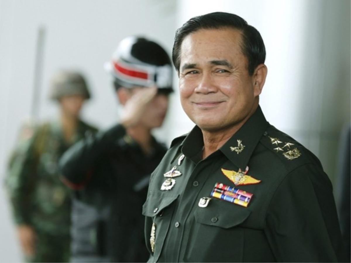 epa04253152 Thai army chief and junta head General Prayuth Chan-ocha smile as he leave after the meeting of the 2015 national budget at the Army Club in Bangkok, Thailand, 13 June 2014. Thailand's army chief General Prayuth Chan-ocha seized power with a coup d'etat on 22 May 2014 and placed the country under martial law. He said an interim government is expected to be formed within the next three months after he seized power on 22 May, saying the coup was necessary to restore order after more than six months of street protests resulting in terrorist attacks and a political gridlock. He vowed to appoint a prime minister once peace is restored, to enact political reforms and hold elections within about 15 months. EPA/NARONG SANGNAK