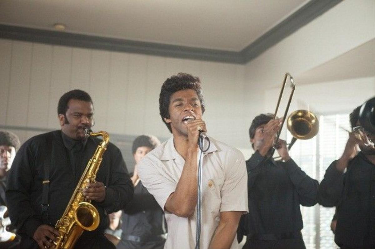 (L to R, foreground) Maceo Parker (CRAIG ROBINSON) and James Brown (CHADWICK BOSEMAN) in in the movie Get on Up. Based on the incredible life story of the Godfather of Soul, the film will give a fearless look inside the music, moves and moods of Brown, taking audiences on the journey from his impoverished childhood to his evolution into one of the most influential figures of the 20th century.