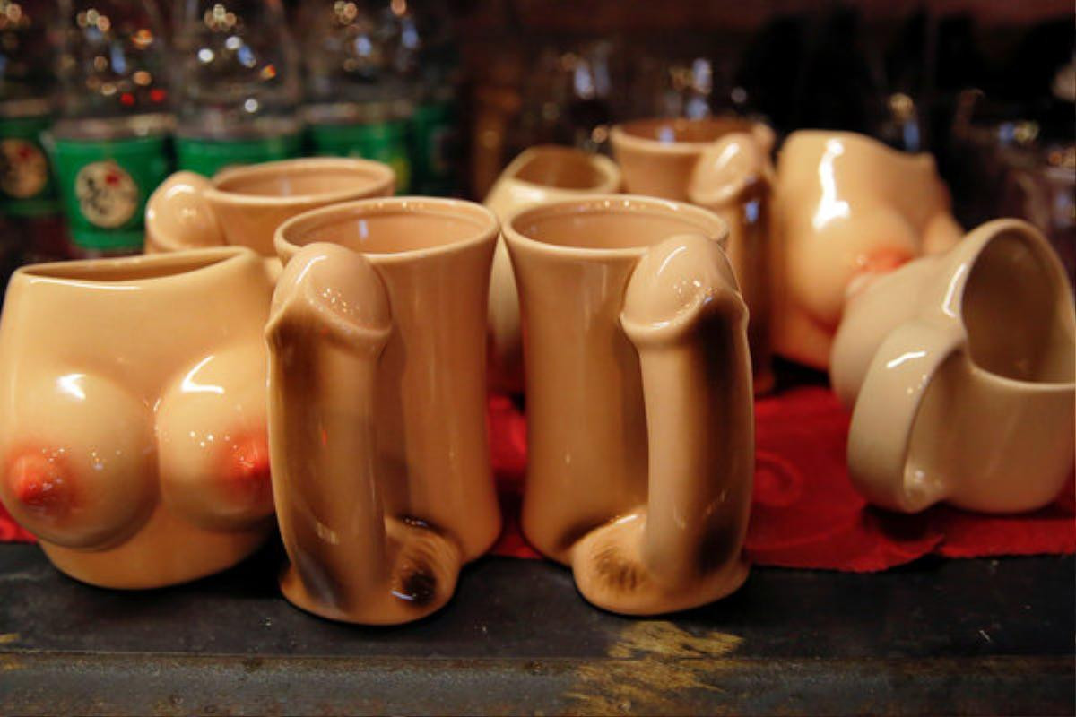 Penis and breast-shaped cups are placed on the bar of Ke'er restaurant (Shell in English) in Beijing, China, May 26, 2016. With drinks served in breast-shaped cups and beers opened with bottle openers shaped like a wooden penis, the father and daughter team behind a Beijing S&M restaurant are encouraging customers to mix food with sex. Owner Lu Lu said business has been good since opening just under a year ago, with young Chinese streaming in to feast on seafood, such as lobster, under the gaze of mannequins wearing bondage gear. REUTERS/Kim Kyung-Hoon TEMPLATE OUT SEARCH "BEIJING SHELL" FOR THIS STORY. SEARCH "THE WIDER IMAGE" FOR ALL STORIES.