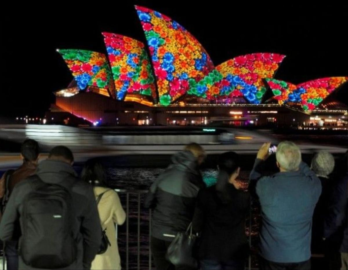 A floral design is projected onto the sails of the Sydney Opera House during the opening night of the annual Vivid Sydney light festival in Sydney, Australia May 27, 2016. REUTERS/Jason Reed - RTX2EGED